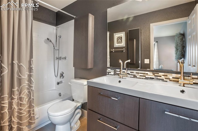7833 Bengali Ln, Colorado Springs, CO 80923 - full bath with toilet, vanity, tasteful backsplash, shower / bath combo with shower curtain, and a textured wall