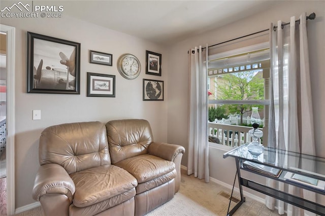 7833 Bengali Ln, Colorado Springs, CO 80923 - carpeted living area featuring baseboards