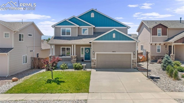 7856 Calabash Rd, Colorado Springs, CO 80908 - craftsman-style house with a porch, board and batten siding, an attached garage, driveway, and stone siding