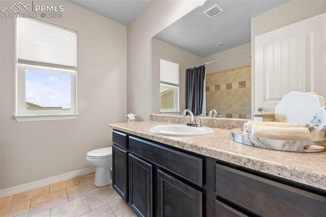 7856 Calabash Rd, Colorado Springs, CO 80908 - full bath with vanity, a shower with curtain, and tile patterned floors