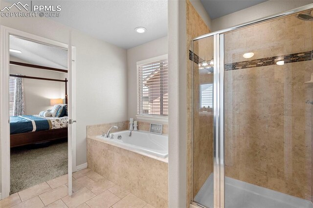 7856 Calabash Rd, Colorado Springs, CO 80908 - ensuite bathroom with a shower stall, a garden tub, and tile patterned flooring