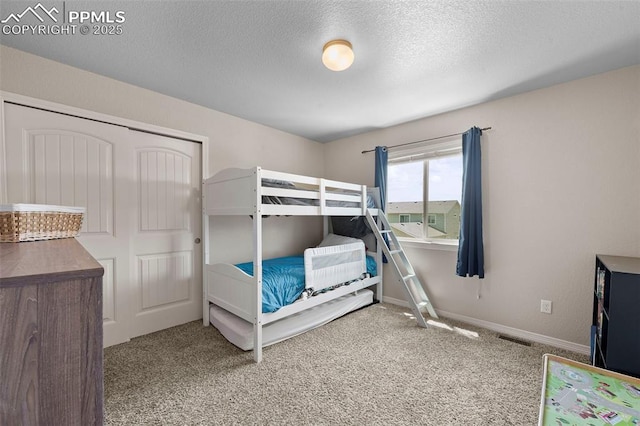 7856 Calabash Rd, Colorado Springs, CO 80908 - carpeted bedroom with a textured ceiling and baseboards