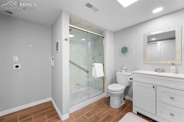 7856 Calabash Rd, Colorado Springs, CO 80908 - full bath with wood tiled floors, vanity, a marble finish shower, and recessed lighting