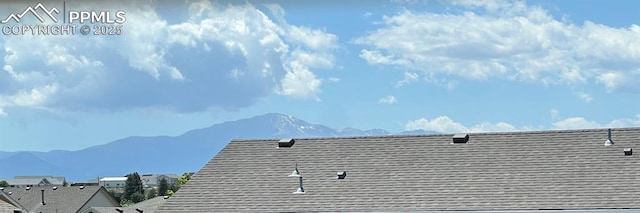7856 Calabash Rd, Colorado Springs, CO 80908 - exterior view of a mountain backdrop and roof with shingles