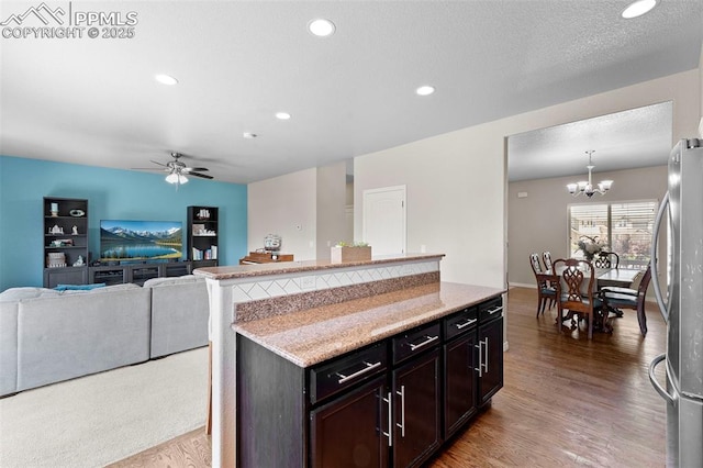 7856 Calabash Rd, Colorado Springs, CO 80908 - kitchen featuring freestanding refrigerator, wood finished floors, a chandelier, ceiling fan, and recessed lighting