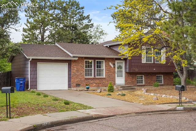 2417 Ranch Ln, Colorado Springs, CO 80918 - tri-level home with an attached garage, concrete driveway, brick siding, and a shingled roof