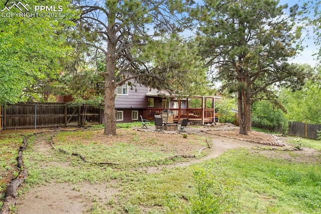 2417 Ranch Ln, Colorado Springs, CO 80918 - fenced backyard with a wooden deck