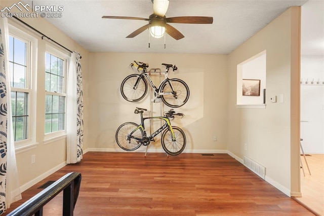 2417 Ranch Ln, Colorado Springs, CO 80918 - unfurnished dining area with wood finished floors, baseboards, and a ceiling fan