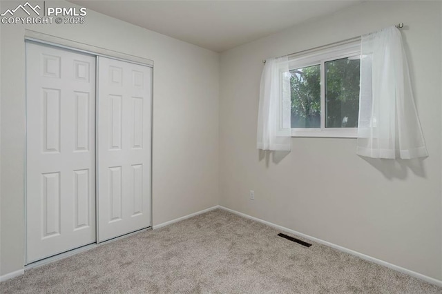 1567 Willshire Dr, Colorado Springs, CO 80906 - unfurnished bedroom with carpet flooring, baseboards, and a closet
