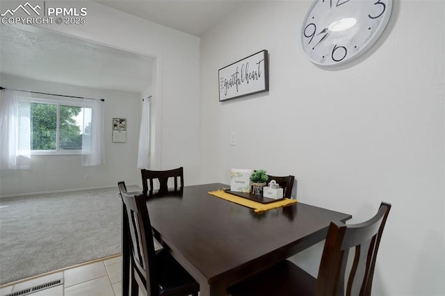 1567 Willshire Dr, Colorado Springs, CO 80906 - dining area with light colored carpet and light tile patterned floors