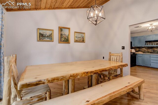 417 W Columbine Ave, Woodland Park, CO 80863 - dining room with a chandelier, wooden ceiling, and light wood-style floors
