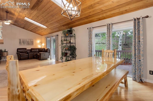 417 W Columbine Ave, Woodland Park, CO 80863 - dining room with vaulted ceiling, light wood finished floors, a chandelier, wood ceiling, and a ceiling fan