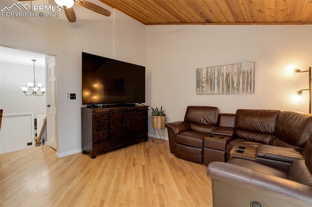 417 W Columbine Ave, Woodland Park, CO 80863 - living room with light wood finished floors, a ceiling fan, baseboards, wood ceiling, and a chandelier