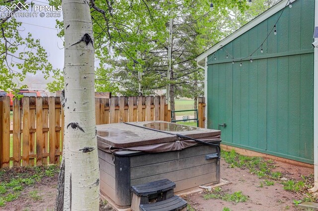 417 W Columbine Ave, Woodland Park, CO 80863 - view of patio / terrace featuring a hot tub