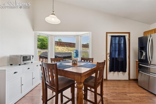 5630 Almont Ave, Colorado Springs, CO 80911 - dining space featuring light wood-style floors and high vaulted ceiling