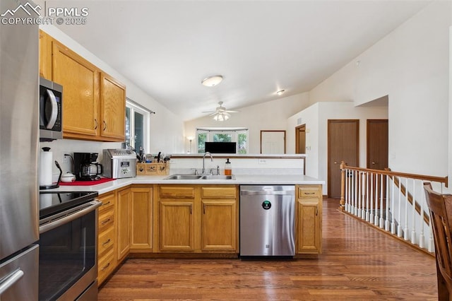 5630 Almont Ave, Colorado Springs, CO 80911 - kitchen with appliances with stainless steel finishes, a sink, lofted ceiling, dark wood-type flooring, and a ceiling fan
