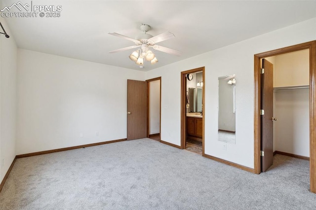 5630 Almont Ave, Colorado Springs, CO 80911 - unfurnished bedroom with carpet, a walk in closet, and baseboards