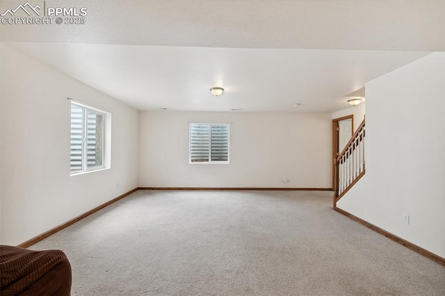 5630 Almont Ave, Colorado Springs, CO 80911 - carpeted spare room featuring baseboards and stairs