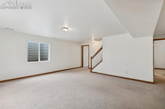 5630 Almont Ave, Colorado Springs, CO 80911 - below grade area with carpet flooring, stairway, and baseboards