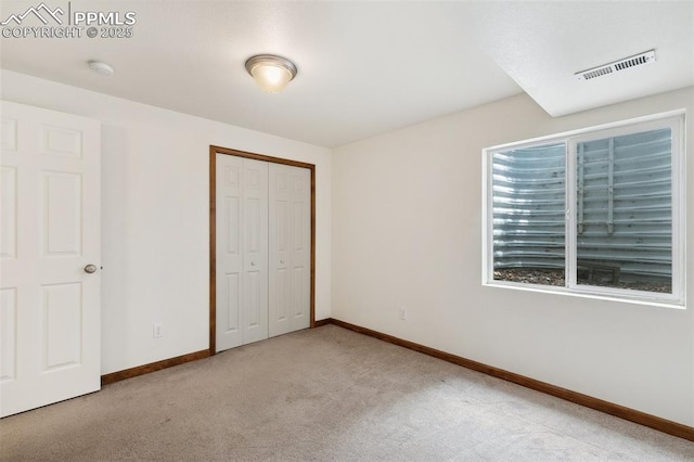5630 Almont Ave, Colorado Springs, CO 80911 - unfurnished bedroom with carpet, baseboards, and a closet