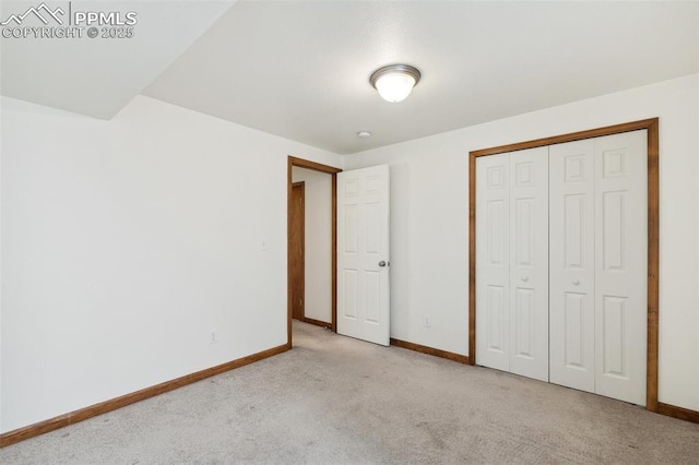 5630 Almont Ave, Colorado Springs, CO 80911 - unfurnished bedroom featuring baseboards, light carpet, and a closet