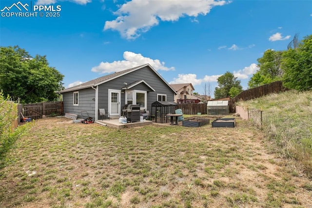 5630 Almont Ave, Colorado Springs, CO 80911 - rear view of property with a garden and a patio area