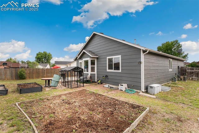 5630 Almont Ave, Colorado Springs, CO 80911 - rear view of property featuring a garden and cooling unit