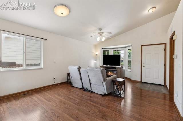 5630 Almont Ave, Colorado Springs, CO 80911 - living area with vaulted ceiling, dark wood-style floors, ceiling fan, and baseboards