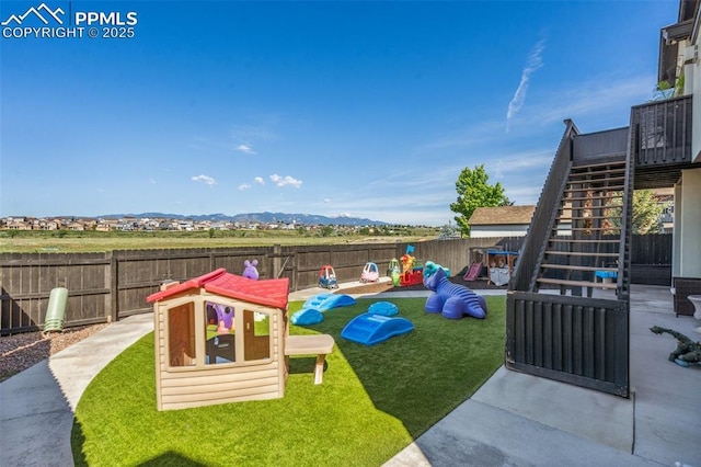 7198 Bigtooth Maple Dr, Colorado Springs, CO 80925 - view of jungle gym with stairway and a mountain view