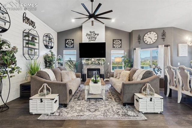 7198 Bigtooth Maple Dr, Colorado Springs, CO 80925 - living room featuring a ceiling fan, high vaulted ceiling, wood finished floors, and a fireplace