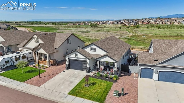 7198 Bigtooth Maple Dr, Colorado Springs, CO 80925 - aerial perspective of suburban area with mountains