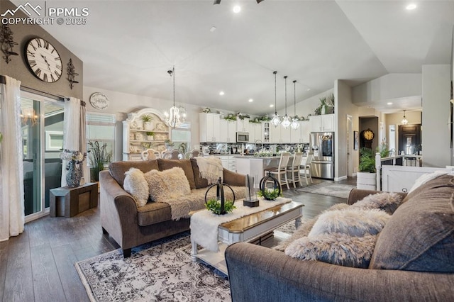 7198 Bigtooth Maple Dr, Colorado Springs, CO 80925 - living area featuring a chandelier, dark wood finished floors, vaulted ceiling, and recessed lighting