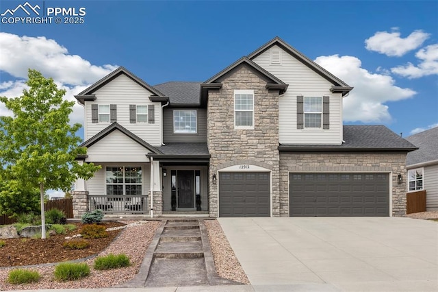 12912 Fishers Island Rd, Peyton, CO 80831 - craftsman house featuring stone siding, driveway, covered porch, and an attached garage