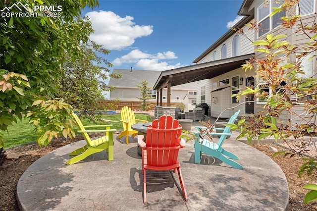 12912 Fishers Island Rd, Peyton, CO 80831 - view of patio with an outdoor fire pit