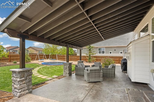 12912 Fishers Island Rd, Peyton, CO 80831 - view of patio with a trampoline, grilling area, and an outdoor hangout area