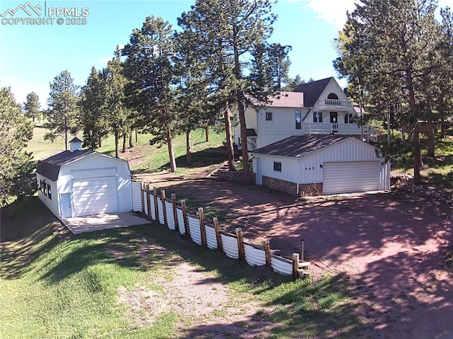 845 Markus Rd, Woodland Park, CO 80863 - view of home's exterior featuring a detached garage and an outbuilding