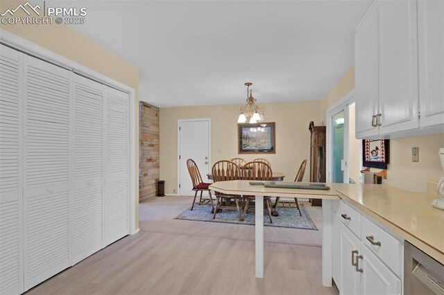 751 Crown Ridge Dr, Colorado Springs, CO 80904 - dining room with a chandelier and light wood-type flooring