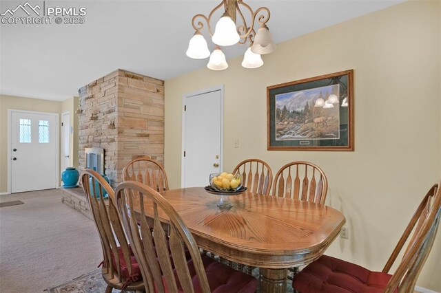751 Crown Ridge Dr, Colorado Springs, CO 80904 - carpeted dining area featuring a chandelier