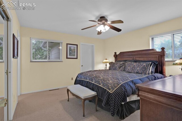 751 Crown Ridge Dr, Colorado Springs, CO 80904 - bedroom with light colored carpet, ceiling fan, and baseboards