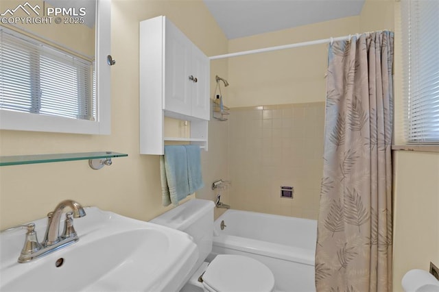 751 Crown Ridge Dr, Colorado Springs, CO 80904 - bathroom with toilet, a sink, shower / tub combo with curtain, and plenty of natural light