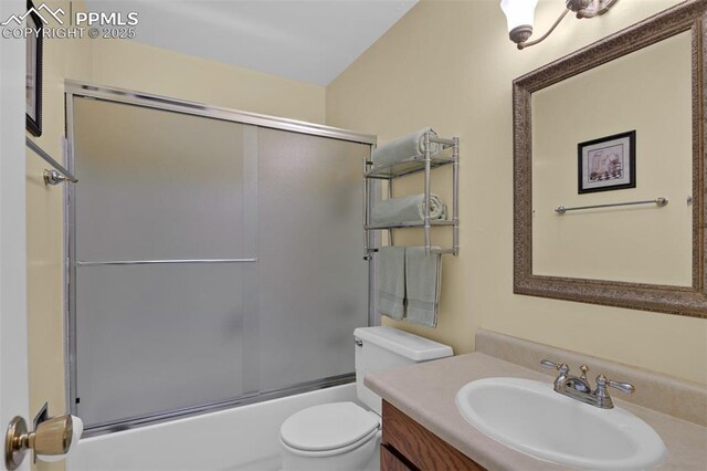 751 Crown Ridge Dr, Colorado Springs, CO 80904 - full bath with vanity, toilet, and shower / bath combination with glass door