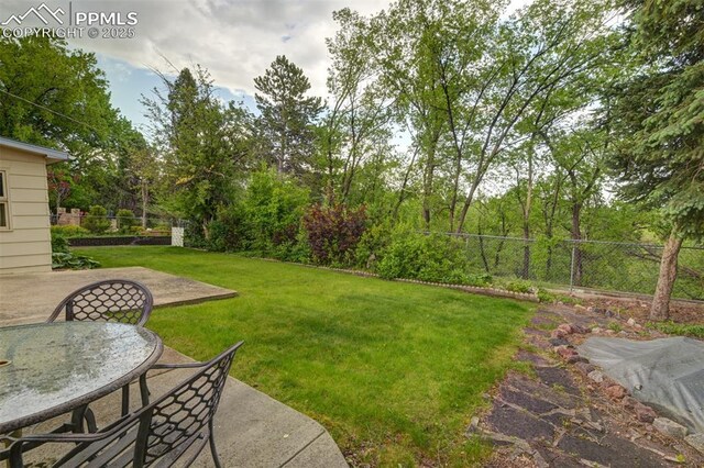 751 Crown Ridge Dr, Colorado Springs, CO 80904 - view of yard featuring a patio area and outdoor dining space
