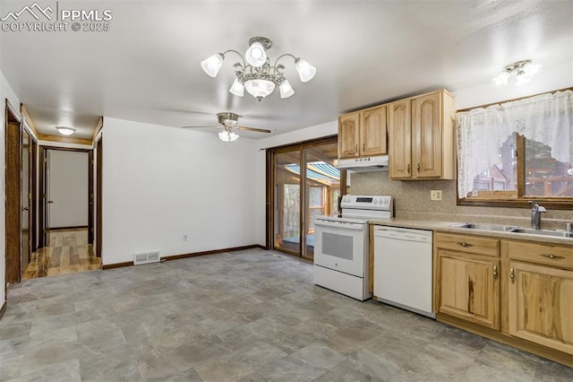 1015 Lafayette Ave, Woodland Park, CO 80863 - kitchen featuring white appliances, a chandelier, light brown cabinetry, under cabinet range hood, and a sink