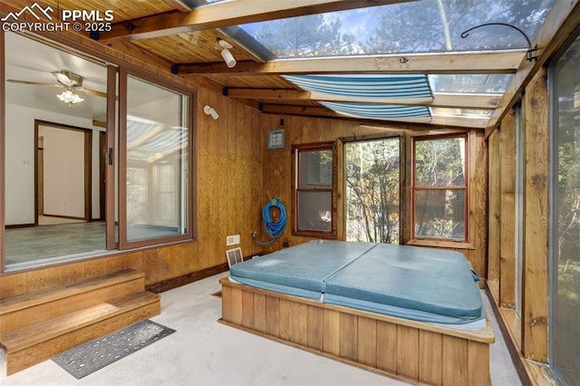 1015 Lafayette Ave, Woodland Park, CO 80863 - game room with wooden walls, concrete flooring, and wooden ceiling with exposed beams
