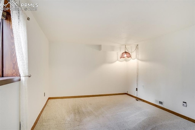 1015 Lafayette Ave, Woodland Park, CO 80863 - spare room featuring carpet and baseboards