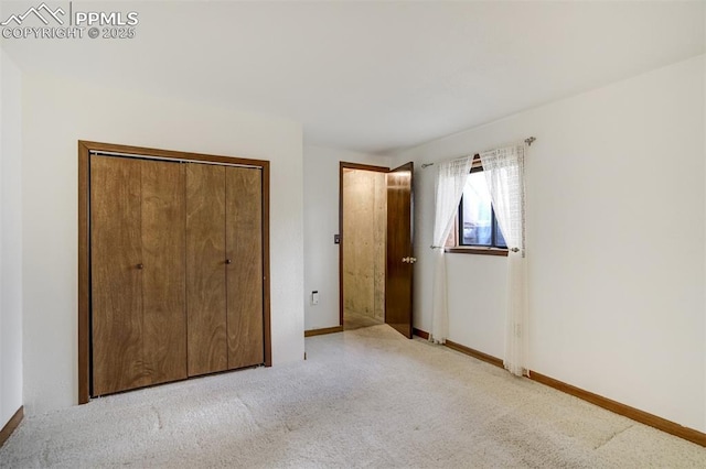 1015 Lafayette Ave, Woodland Park, CO 80863 - unfurnished bedroom with carpet floors, baseboards, and a closet