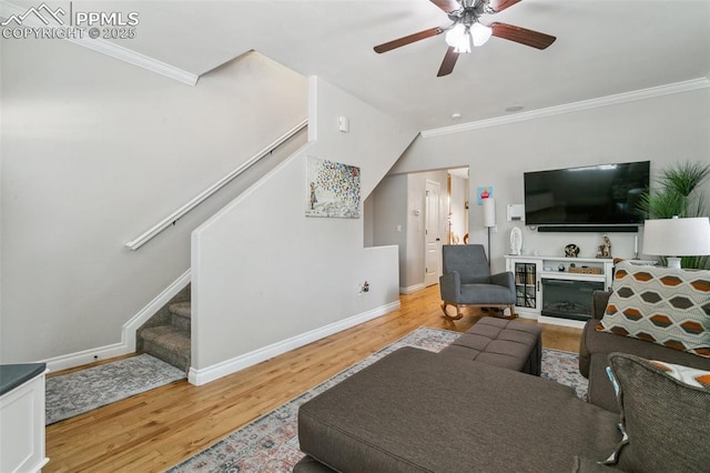 1502 York Rd Unit 103, Colorado Springs, CO 80918 - living room featuring stairway, wood finished floors, ornamental molding, baseboards, and a ceiling fan