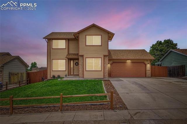 1155 Hallamwood Dr, Colorado Springs, CO 80911 - traditional-style house featuring an attached garage, concrete driveway, and brick siding