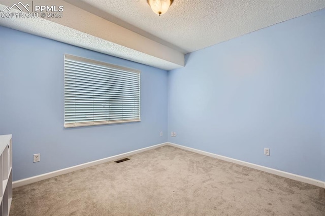 1155 Hallamwood Dr, Colorado Springs, CO 80911 - carpeted spare room with baseboards and a textured ceiling
