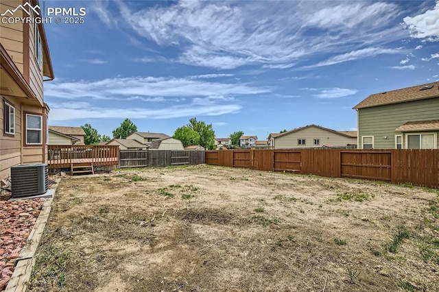 1155 Hallamwood Dr, Colorado Springs, CO 80911 - fenced backyard with central AC unit, a deck, and a residential view